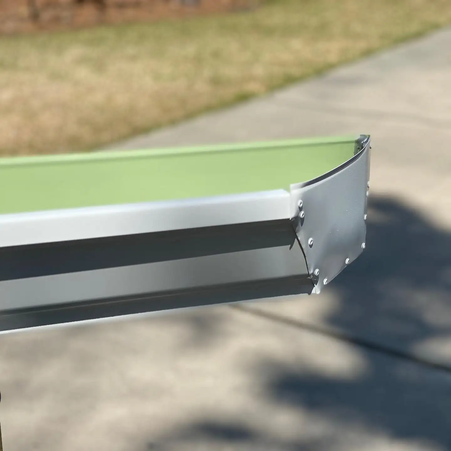Close-up of the end cap on a new white seamless gutter section. Gutter Guards in Bluffton, SC by A&A Island Services